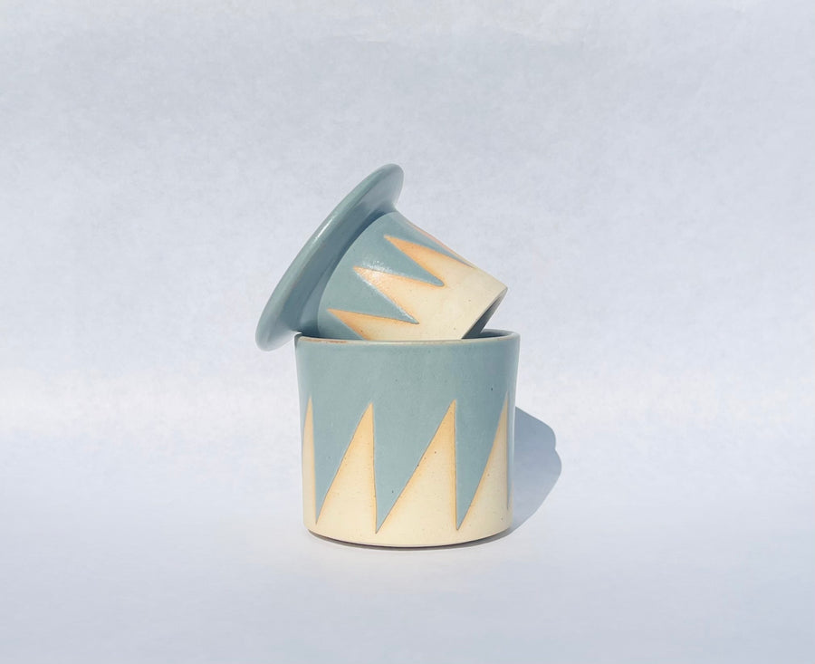 Handmade ceramic butter crock with light blue and cream colored pattern